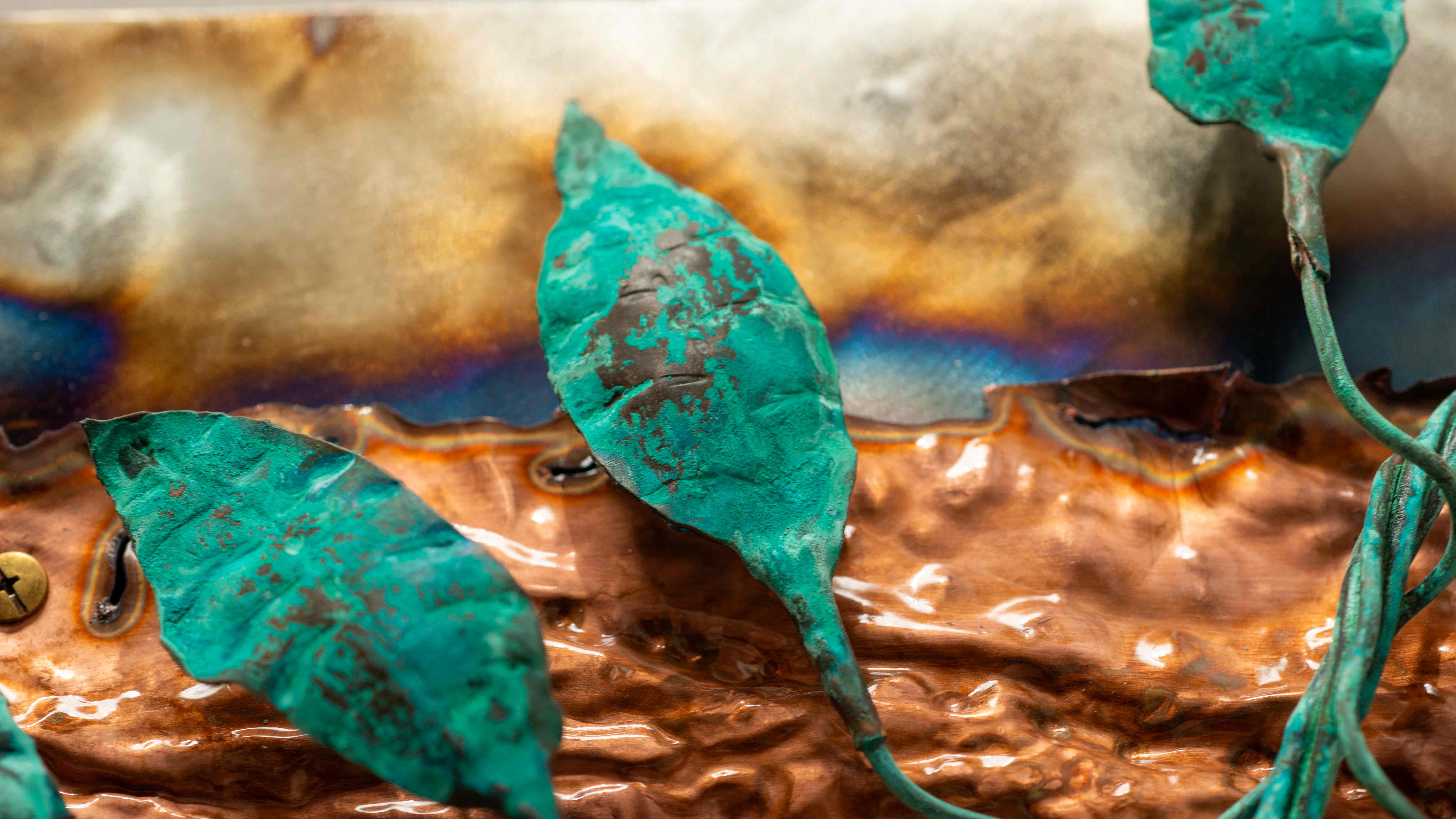 Teal patina metal leaves with copper base detail